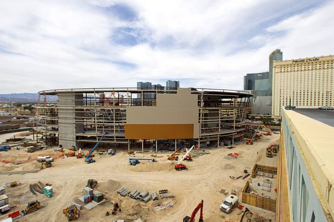 Construction continues on a $375 million sports arena between New York-New York and the Monte Carlo casinos Sunday, March 22, 2015. The 20,000-seat arena, a collaboration between MGM Resorts International and AEG, is expected to open in spring 2016.