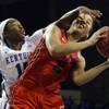 Dayton's Amber Deane, right, is pressured by Kentucky's Linnae Harper during the first half of a women's college basketball game in the second round of the NCAA tournament in Lexington, Ky., Sunday, March 22, 2015. 