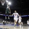 Michigan State's Travis Trice, left, goes up to dunk against Virginia during the first half of an NCAA tournament college basketball game in the Round of 32 in Charlotte, N.C., on Sunday, March 22, 2015.