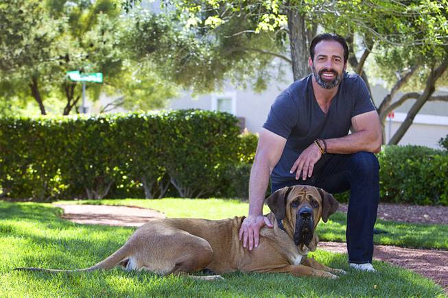 Former Clark County Commissioner Dario Herrera poses with his dog Kaaya, a 3-year-old Tosa, near his home in Las Vegas Tuesday, March 24, 2015. Herrera is getting past his conviction in the G-Sting political corruption scandal and is co-founder of Acento Digital Media, a social media company.