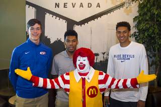 Ronald McDonald poses with high school basketball players, from left, Stephen Zimmerman, Allonzo Trier and Chase Jeter, during a send-off party at McDonald's, 6690 S. Rainbow Blvd., Tuesday, March 24, 2015. The players were selected for the McDonald's All-American high school basketball game in Chicago on April 1 on April 1.