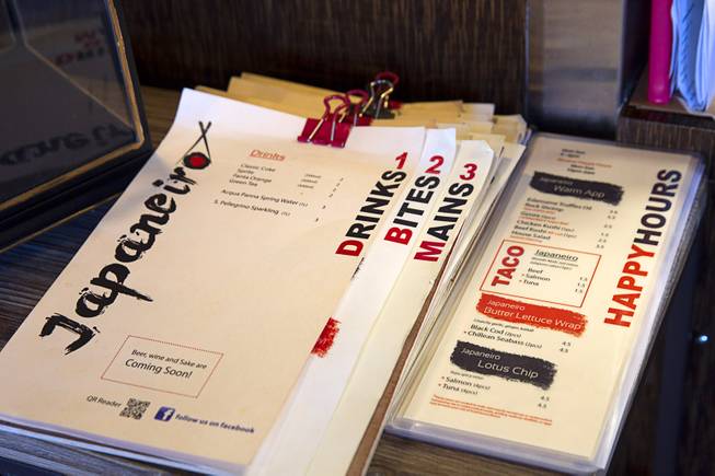 Dinner menus, left, and Happy Hour menus are shown at Japaneiro, an Asian fusion restaurant at 7315 W. Warm Springs Rd., Wednesday, March 25, 2015. The restaurant opened in October 2014.