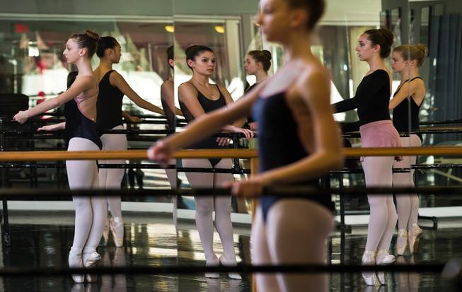 (from left) Ballerina Monika Haczkiewicz, 17, does bar exercises with others in dance class inside the Keith Kleven Institute on Wednesday, March, 4, 2015. She's going to New York City in April with instructor Tara Foy to compete for a chance to attend a prestigious dance school or join a ballet company.