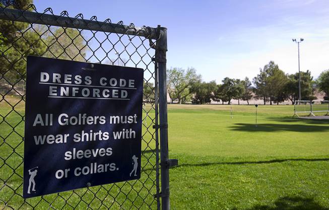 A sign posts the dress code at the Municipal Par 3 Golf Course, 324 E Brooks Ave., in North Las Vegas Wednesday, March 25, 2015.