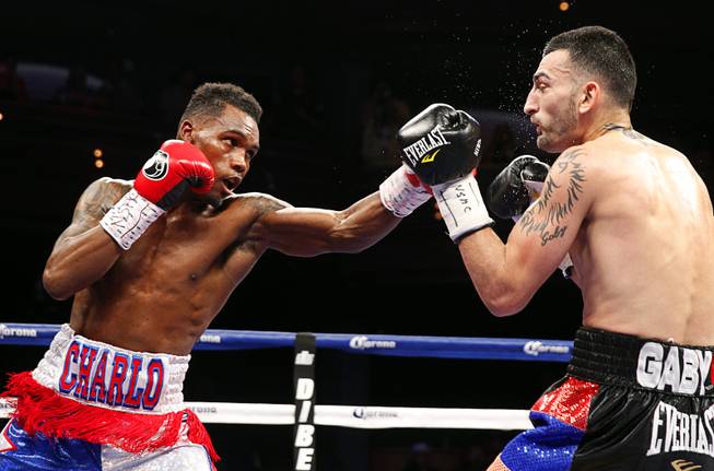Jermell Charlo, left, of Richmond, Texas, punches Vanes Martirosyan of Armenia during their super welterweight bout at the Palms Saturday, March 28, 2015.
