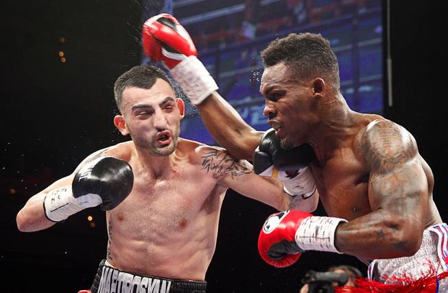 Jermell Charlo, right, of Richmond, Texas, battles with Vanes Martirosyan of Armenia during their super welterweight bout at the Palms Saturday, March 28, 2015.