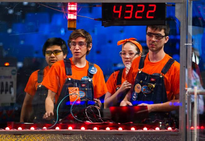 Team Clockwork Oranges of Orange, Calif., control their robot in the arena during a match at the FIRST Robotics Competition at the Cashman Center on Friday, March, 27, 2015.
