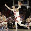 Wisconsin forward Sam Dekker celebrates Wisconsin beating Arizona 85-78 in a college basketball regional final in the NCAA Tournament on Saturday, March 28, 2015, in Los Angeles. Wisconsin advances to the Final Four in Indianapolis.