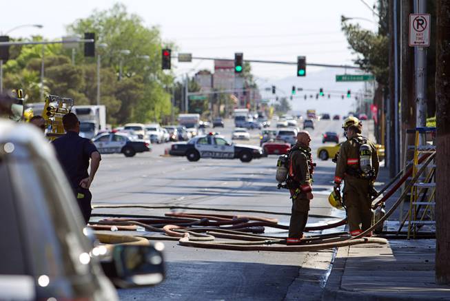 Traffic on Tropicana Avenue is blocked off in both directions during a two-alarm apartment fire near Tropicana and Eastern Avenue, March 30, 2015.