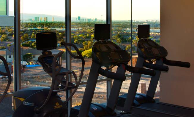 The workout room at Vantage Lofts offers an array of exercise equipment over stunning skyline views of the Las Vegas Strip on Wednesday, March, 25, 2015.