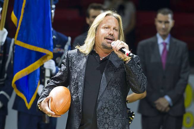 Motley Crue singer and Las Vegas Outlaws owner Vince Neil sings the national anthem during the Outlaws' inaugural game against the San Jose SaberCats at the Thomas & Mack Center Monday, March 30, 2015.
