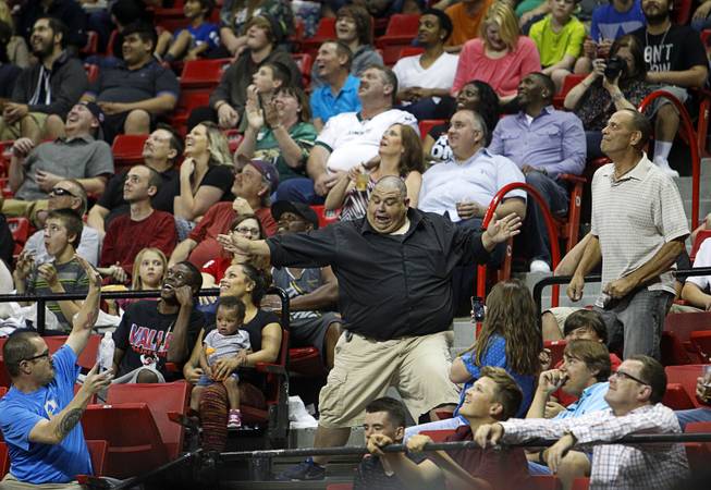 A man dances in the audience during the Outlaws' inaugural game against the San Jose SaberCats at the Thomas & Mack Center Monday, March 30, 2015.