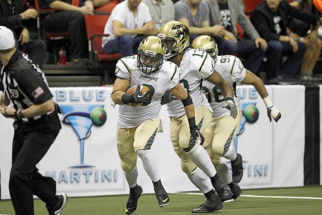 David Hyland (3) runs for a touchdown after an Outlaws' turnover during the Outlaws' inaugural game against the San Jose SaberCats at the Thomas & Mack Center Monday, March 30, 2015.