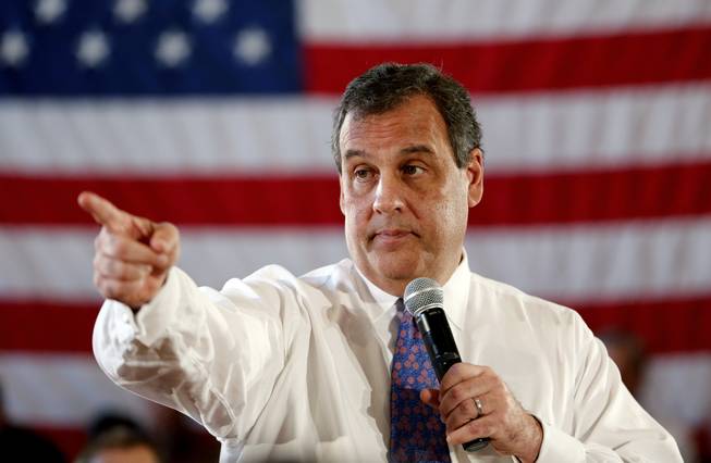 In this March 24, 2015, file photo, New Jersey Gov. Chris Christie calls on an audience member to ask a question during a town hall meeting at the Hanover Township Community Center in Whippany, N.J.
