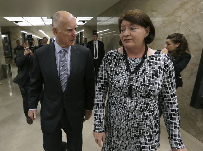 Gov. Jerry Brown and Assembly Speaker Toni Atkins, of San Diego return to Brown's office after a news conference where he and other Legislative leaders unveiled a proposed $1 billion package of emergency drought-relief legislation at the Capitol in Sacramento, Calif., Thursday, March 19, 2015. The proposal accelerates spending already approved by voters for water and flood projects. It includes money for emergency drinking water, food aid for the hardest-hit counties, fish and wildlife protections and groundwater management.
