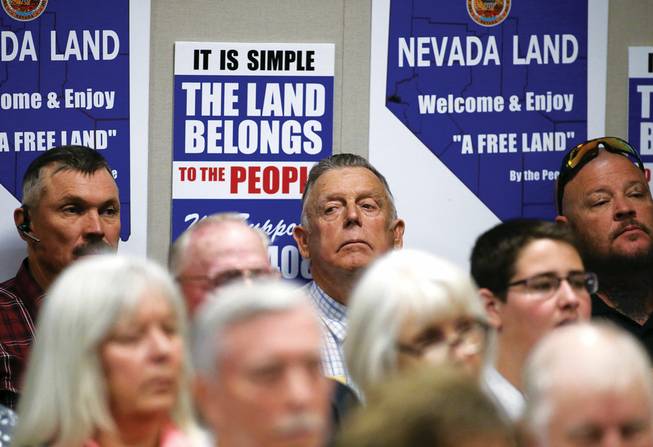 Nevada rancher Cliven Bundy, center, listens to testimony on a bill challenging federal control of Nevada public lands in a hearing at the Legislative Building in Carson City, Tuesday, March 31, 2015. Bundy garnered national attention a year ago when he and armed supporters engaged in a showdown with federal authorities.