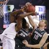Michigan State's Branden Dawson, center, and Matt Costello, right, block a shot by Duke's Justise Winslow during the second half of the NCAA Final Four tournament semifinal game Saturday, April 4, 2015, in Indianapolis.