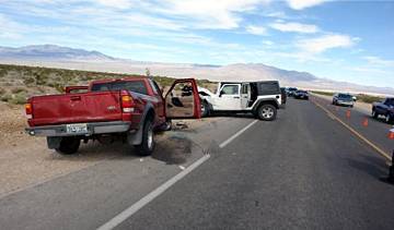 This photo provided by Nevada Highway Patrol shows a crash scene on Kyle Canyon Road involving Las Vegas political consultant Gary Gray, Thursday, April 9, 2015.
