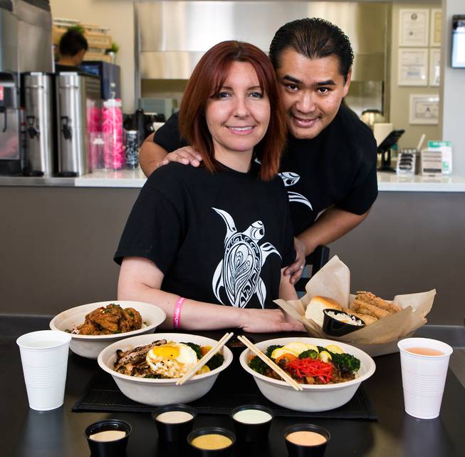 Mochiko Chicken owners Sandra Lenska and Jerry Misa with some of their tasty dishes on Tuesday, April, 7, 2015.