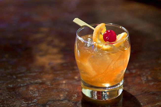 A Old Fashioned made with George Dickel whiskey is shown at the Double Helix Wine & Whiskey Lounge in Town Square Sunday, April 12, 2015.   .