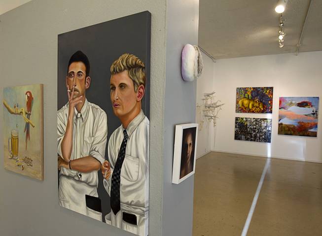 "Two Guys" by Babette Carpenter, left, is displayed at the 26th annual Contemporary Arts center Juried Show at the ALIOS art gallery, 1217 S Main St., Monday, April 13, 2015.  .