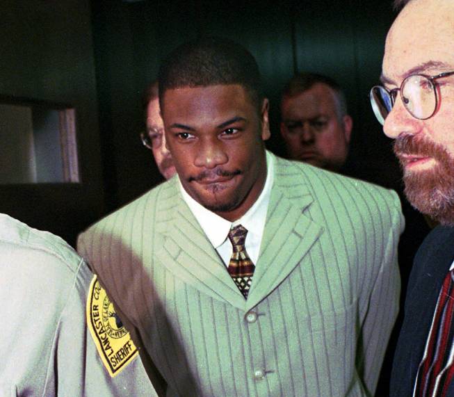 In this March 11, 1997 file photo, St. Louis Rams' Lawrence Phillips leaves Lancaster County Court in Lincoln, Neb., to begin a 30-day sentence for a probation violation. Phillips, 34, was sentenced Friday, Dec. 18, 2009, in San Diego for assault and other crimes. Phillips has been sentenced to more than 31 years in prison for attacking his girlfriend and driving his car into three teens. 