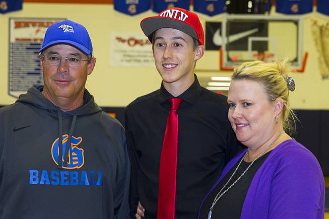 Chase Maddux poses with his parents Greg and Kathy Maddux during a signing day ceremony at Bishop Gorman High School Wednesday, April 15, 2015. Chase Maddux signed a national letter of intent to play baseball for UNLV. T .