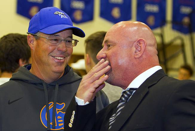Former MLB pitcher Greg Maddux, father of Chase Maddux, listens to Sean Randles Sr., father of wrestler Sean Randles Jr., during a signing day ceremony at Bishop Gorman High School Wednesday, April 15, 2015. Chase Maddux signed a national letter of intent to play baseball for UNLV. Sean Randles Jr. will wrestle for Norwich university in Vermont.  .