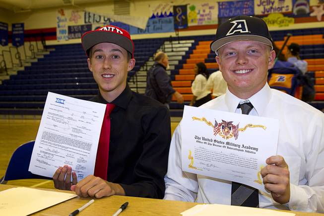 Baseball players Chase Maddux, left, and Matt Hudgins pose with national letters of intent during a signing day ceremony at Bishop Gorman High School Wednesday, April 15, 2015. Chase Maddux signed a letter of intent to play baseball for UNLV. Hudgins will play for the Unites States Military Academy in New York.  .