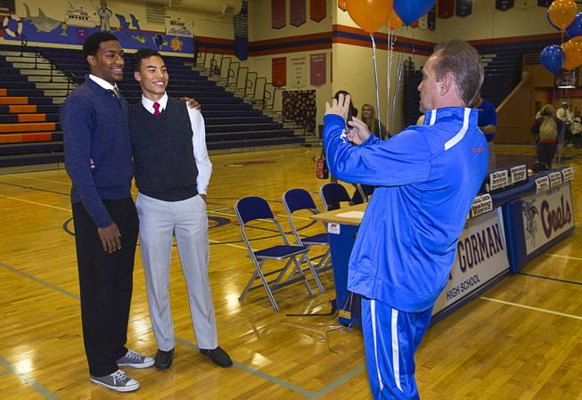 Basketball players Nick Blair, left, and Richie Thornton pose for a photo during a signing day ceremony at Bishop Gorman High School Wednesday, April 15, 2015. Eight student-athletes signed national letters of intent.  .