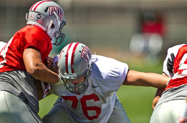 UNLV football player Kyle Saxelid (76) blocks out defenders during the Spring Showcase, the last official gathering for the Rebels and coach Tony Sanchez before August on Saturday, April 18, 2015.