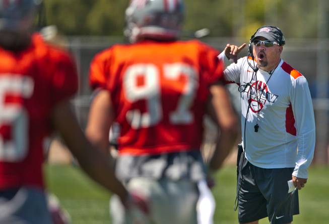 UNLV football head coach Tony Sanchez yells orders to his players during the Spring Showcase, the last official gathering for the Rebels before August on Saturday, April 18, 2015.