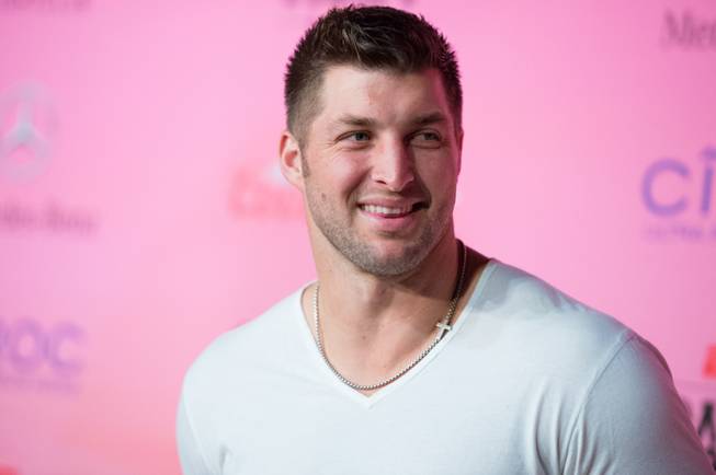 Tim Tebow arrives at the ESPN Super Bowl XLIX Party on Friday, Jan. 30, 2015, in Scottsdale, Ariz.