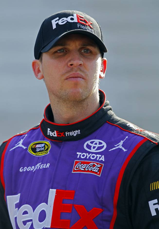 Driver Denny Hamlin looks at the time tower during practice for a NASCAR Sprint Cup Series auto race at Bristol Motor Speedway on Saturday, April 18, 2015, in Bristol, Tenn.