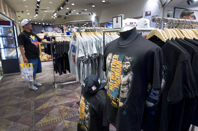 John Salvador of Tacoma, Wash. shops for T-shirts at the Official Fight Merchandise Store in the MGM Grand Monday, April 20, 2015. Floyd Mayweather Jr. and Manny Pacquiao will fight at the MGM Grand Garden Arena on Saturday, May 2.  ..