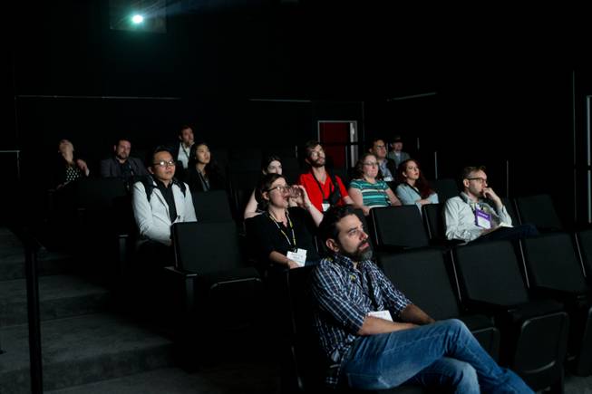 Attendees take in a demo from Dolby Atmos at the trade show during the the star-studded CinemaCon Convention officially run by the National Association of Theatre Owners (NATO) at Caesars Palace on Tuesday, April 21, 2015.