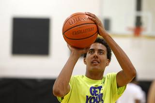 Greg Floyd Jr. shoots free throws during practice with the Las Vegas Knicks, an Amateur Athletic Union (AAU) team, at Clark High School Tuesday, April 21, 2015.  Floyd, a sophomore at Desert Pines High School, picked up a basketball scholarship offer this week from UNLV.   ..