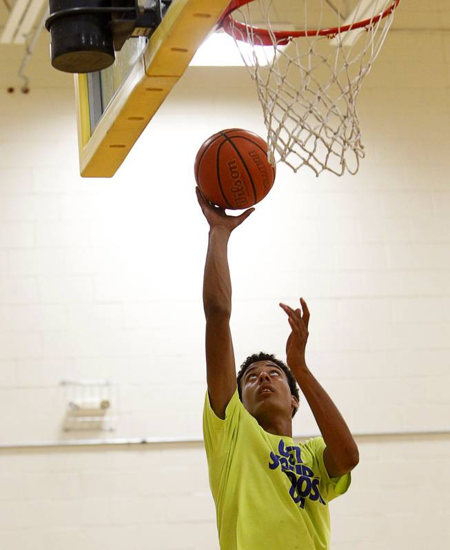 Greg Floyd Jr. lays up the ball during practice with the Las Vegas Knicks, an Amateur Athletic Union (AAU) team, at Clark High School Tuesday, April 21, 2015.  Floyd, a sophomore at Desert Pines High School, picked up a basketball scholarship offer this week from UNLV.   ..