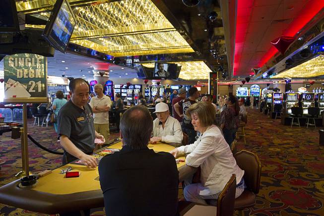 Gamblers play blackjack at the Riviera Wednesday, April 22, 2015. The casino, which opened on April 20, 1955, will close on May 4. The Las Vegas Convention and Visitors Authority purchased the property to make way for an expansion of the Las Vegas Convention Center.  ..