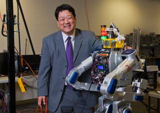 UNLV professor Paul Oh stands with their Metal Rebel as they are finally opening the doors on a newly built lab for its drone and robotics programs on Thursday, April 23, 2015.