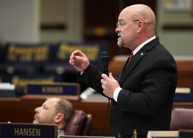 In this April 21, 2015, photo, Nevada Assemblyman Ira Hansen, R-Sparks, speaks during Assembly floor debate about a bill that would require transgender students to use school facilities based on their biological gender, in Carson City, Nev., on Tuesday, April 21, 2015. The Nevada Assembly rejected the bill that outraged transgender advocates. 