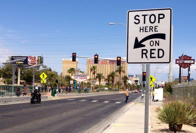 A new traffic signal and crosswalk are shown Thursday, April 23, 2015, at the Welcome to Fabulous Las Vegas sign on Las Vegas Boulevard.