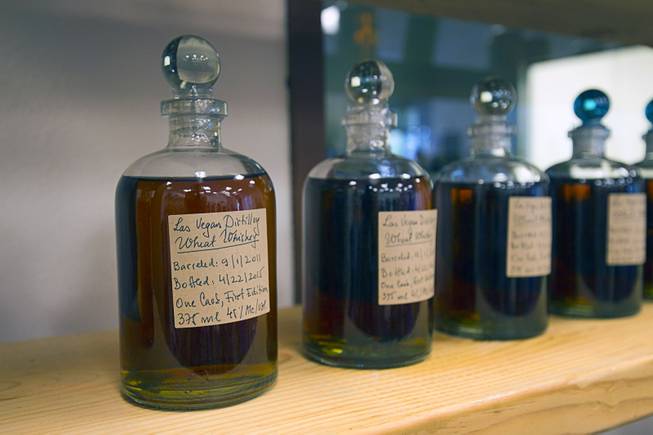 Wheat whiskeys are shown on a shelf during the first St. George Day Spring Whiskey Barreling celebration at the Las Vegas Distillery in Henderson Saturday, April 25, 2015. The event marked the first bottling of four-year-old whiskey from the distillery's 50-gallon barrels.