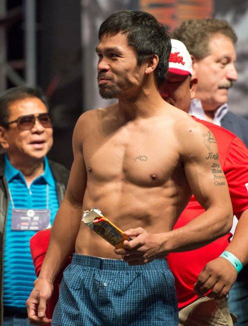 Manny Pacquiao enjoys Butterfinger Peanut Butter Cups during the weigh-in ...
