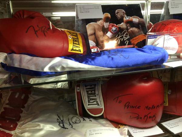 Autographed Manny Pacquiao trunks, a Floyd Mayweather Jr. photo and more are on display by the Westgate sports book Saturday, May 2, 2015.