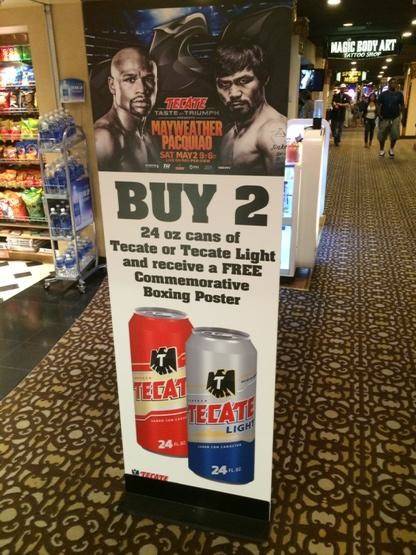 A shop at Circus Circus offers a deal for beer and a poster for the Mayweather-Pacquiao fight Saturday, May 2, 2015.