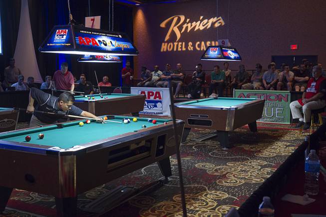 5:38 p.m. - Ryan Garcia, left, of Lake Jackson, Texas competes in the finals of the American Poolplayers Association (APA) tournament in the Riviera Sunday, May 3, 2015. Garcia finished first in his division. The APA tournament has been coming to the Riviera for the past 23 years. STEVE MARCUS