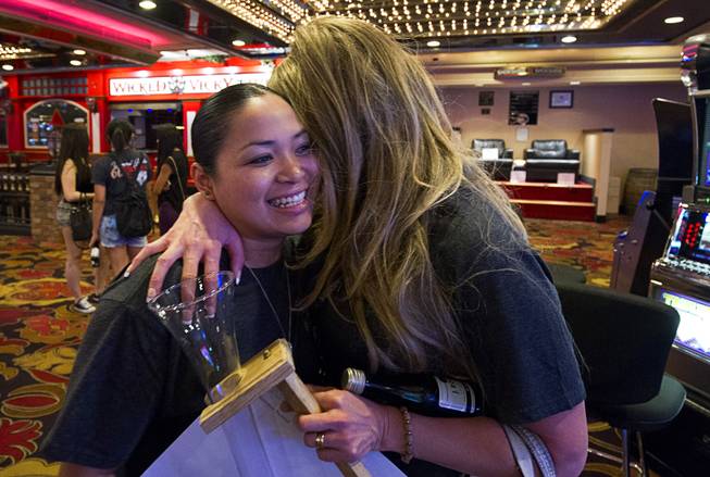 12:21 p.m. - Michelle Cabrera, left, general manager for restaurants, gets a farewell hug from server Jenny Echeverria as the Riviera Casino closes Monday, May 4, 2015. The 60-year-old Riviera, which was the Las Vegas Strip's first high-rise property, will be imploded to make way for a $2.3 billion convention center business district facility.