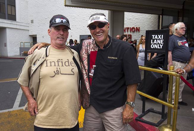 12:33 p.m. - Riviera valet supervisor Ron Lieber, left, poses with doorman Ilija Janjusic after the Riviera was closed Monday, May 4, 2015. Lieber said that after 39 years with the Teamster Union Local 986, his retirement stated today. He had been with the Riviera for almost 30 year, he said. 
