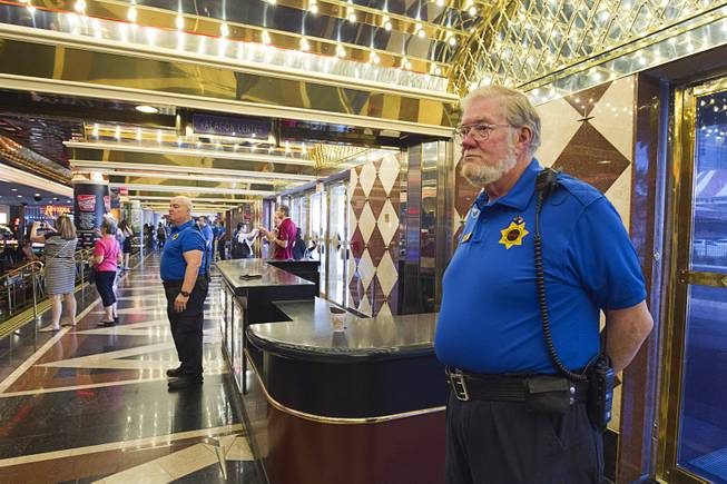 12:02 p.m. - Security officer Walt Dickerson stands by the front doors of the Riviera Monday, May 4, 2015. Dickerson has been working at the Riviera for 26 years, he said. STEVE MARCUS